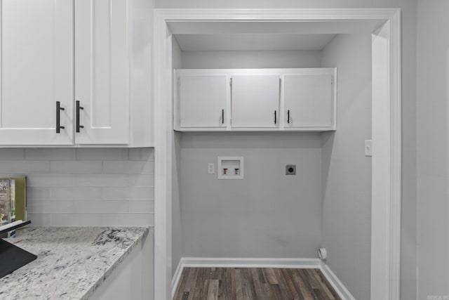 clothes washing area with hookup for a washing machine, cabinets, dark hardwood / wood-style floors, and hookup for an electric dryer