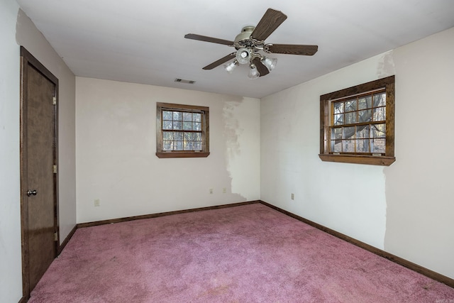 spare room with carpet and ceiling fan