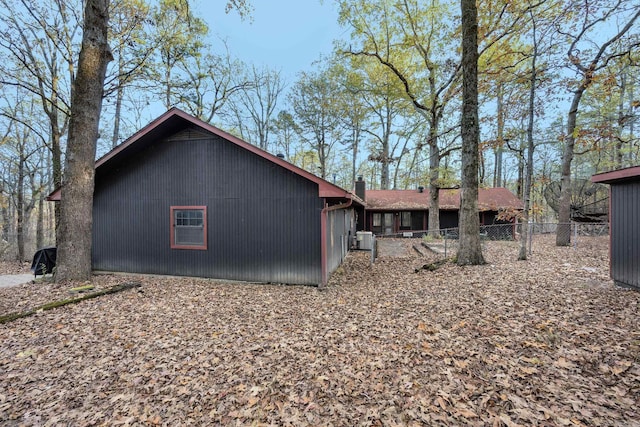 back of property featuring central air condition unit