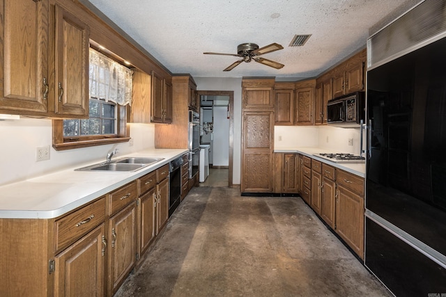 kitchen featuring ceiling fan, sink, black appliances, and a textured ceiling