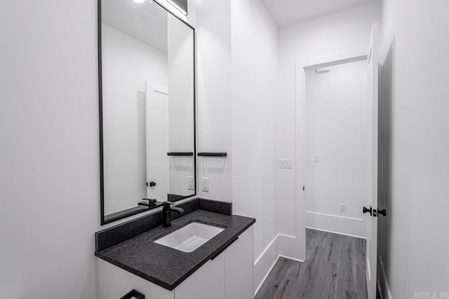 bathroom with wood-type flooring and vanity