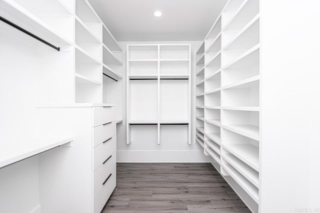 spacious closet featuring hardwood / wood-style floors