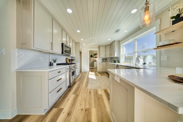 kitchen with pendant lighting, light hardwood / wood-style flooring, tasteful backsplash, wood ceiling, and stainless steel appliances