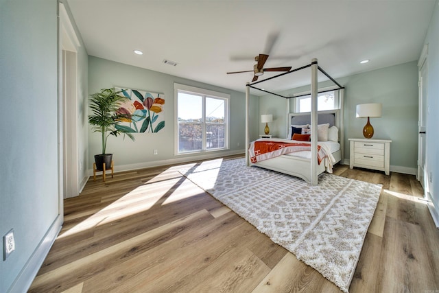 bedroom featuring light hardwood / wood-style flooring and ceiling fan