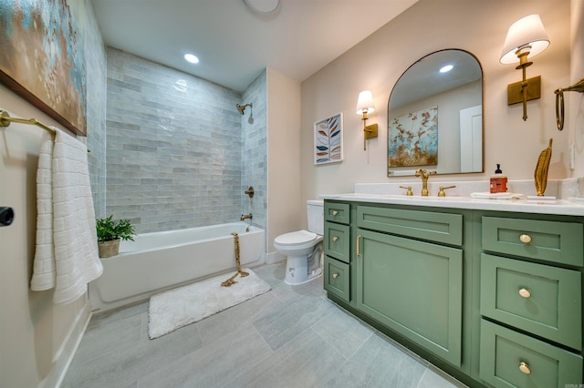 full bathroom with vanity, tiled shower / bath combo, and toilet