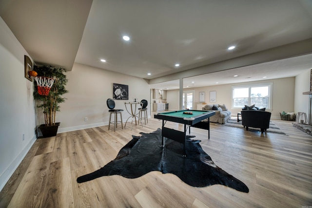 game room with light hardwood / wood-style flooring and pool table