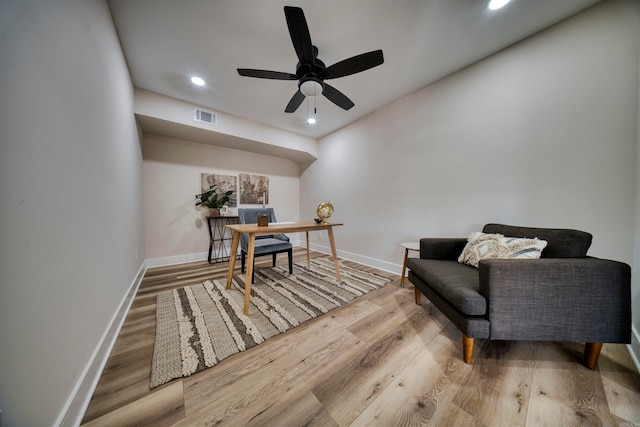 home office featuring ceiling fan and hardwood / wood-style flooring