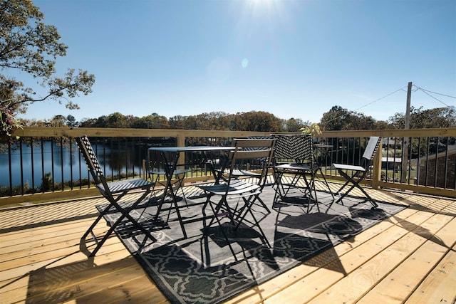 wooden deck featuring a water view