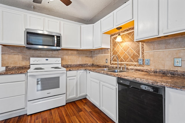 kitchen featuring electric stove, sink, a textured ceiling, and black dishwasher