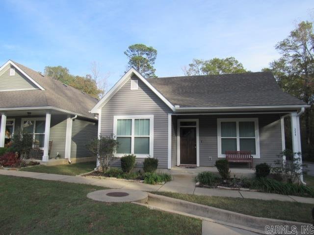 view of front of house with a front lawn and a porch