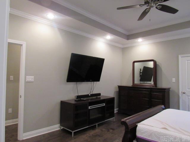 bedroom featuring dark hardwood / wood-style floors, ceiling fan, and ornamental molding