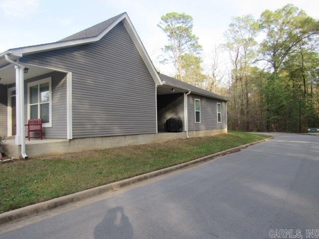 view of property exterior with a yard