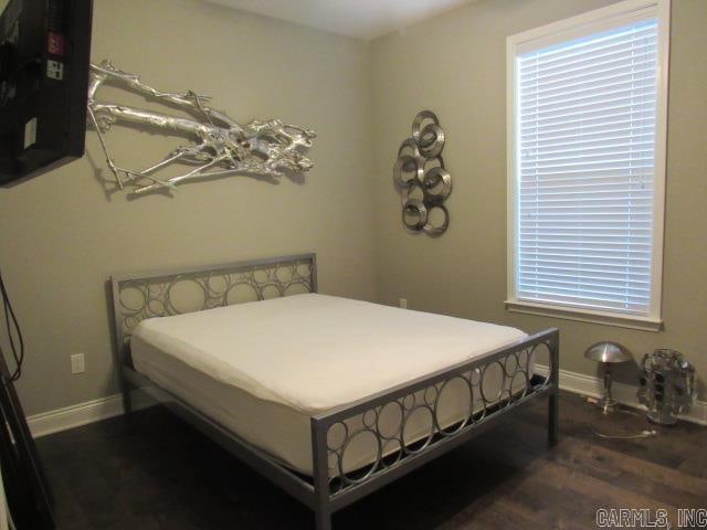 bedroom featuring dark hardwood / wood-style floors