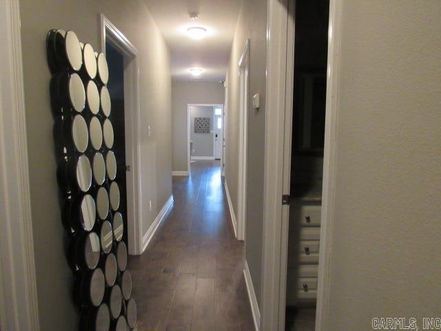 hallway with dark wood-type flooring