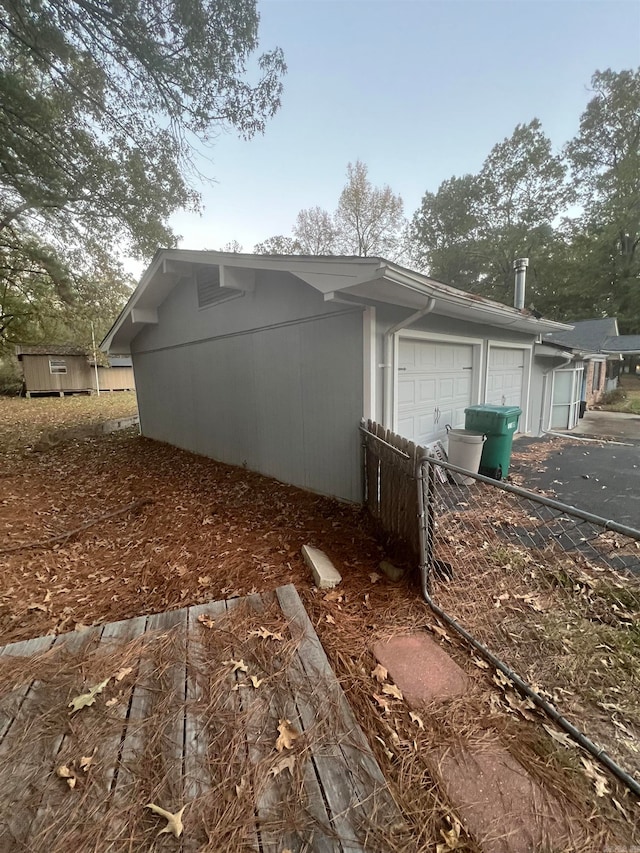 view of property exterior featuring a garage