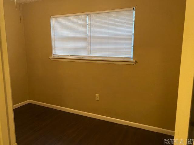 empty room with hardwood / wood-style floors