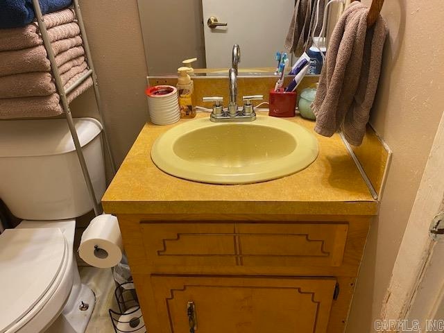 bathroom featuring vanity and toilet