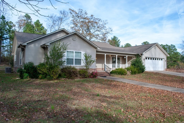 single story home with central air condition unit, a front lawn, a porch, and a garage