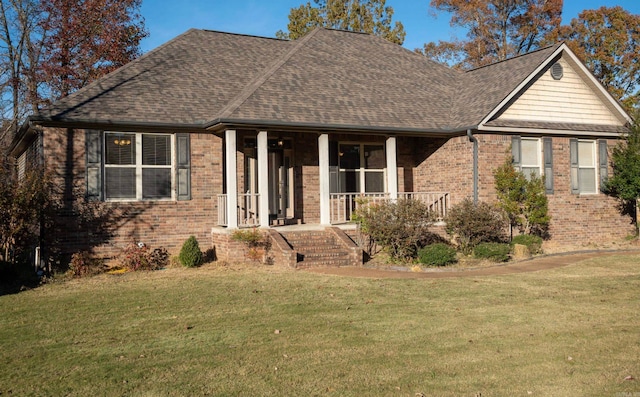 view of front of home featuring a porch and a front lawn