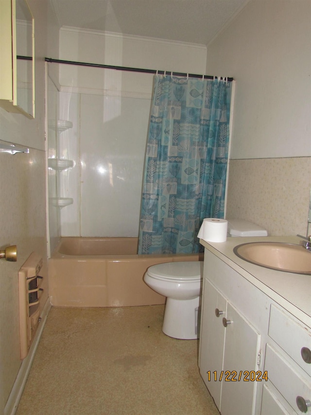 full bathroom featuring shower / bath combo, vanity, toilet, and crown molding