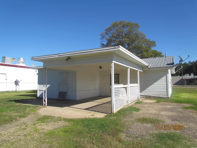 view of home's exterior with a carport