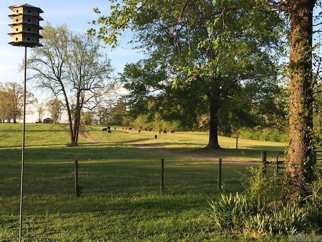 view of property's community with a lawn