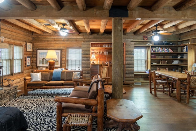 living room with wood ceiling, ceiling fan, log walls, wood-type flooring, and beamed ceiling