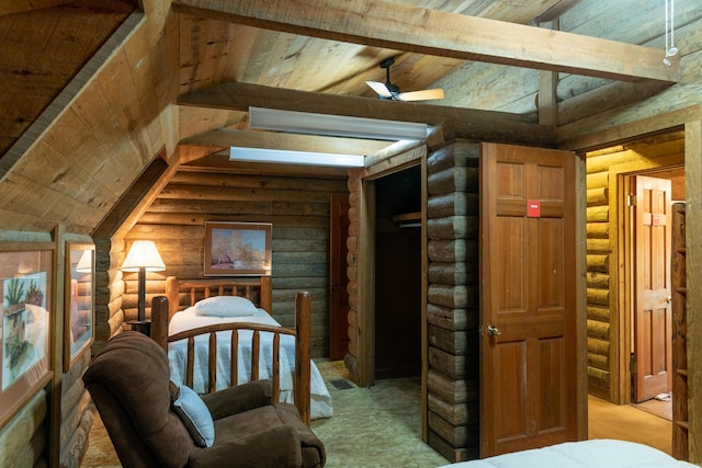 bedroom with wood ceiling, log walls, and lofted ceiling with beams