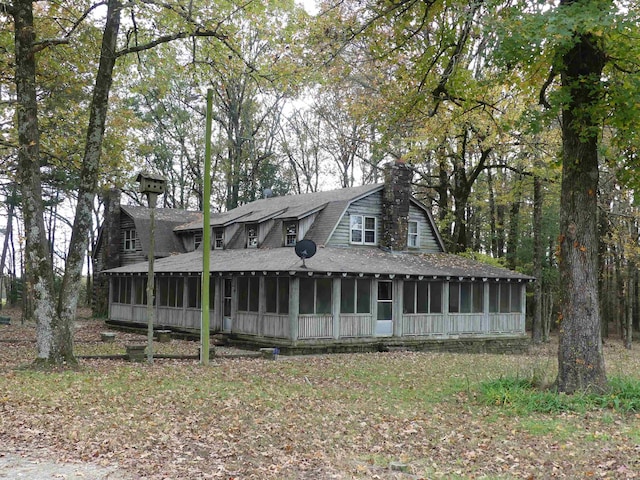 view of front facade featuring a sunroom