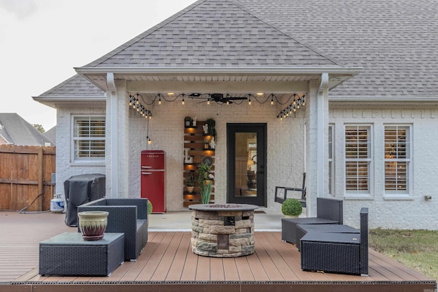 wooden deck featuring a fire pit