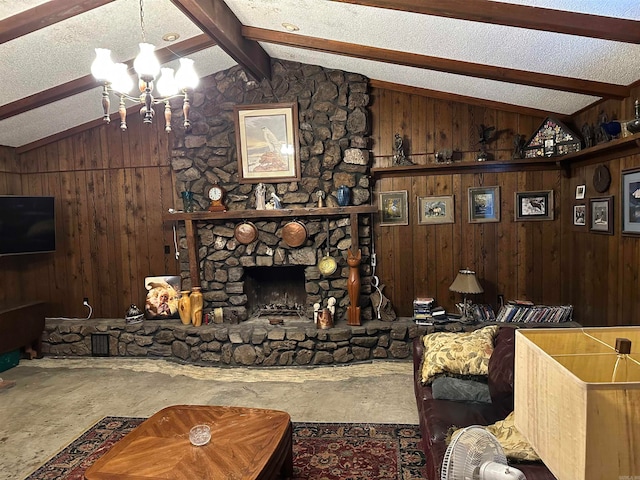 living room featuring a textured ceiling, wooden walls, a notable chandelier, a fireplace, and vaulted ceiling with beams