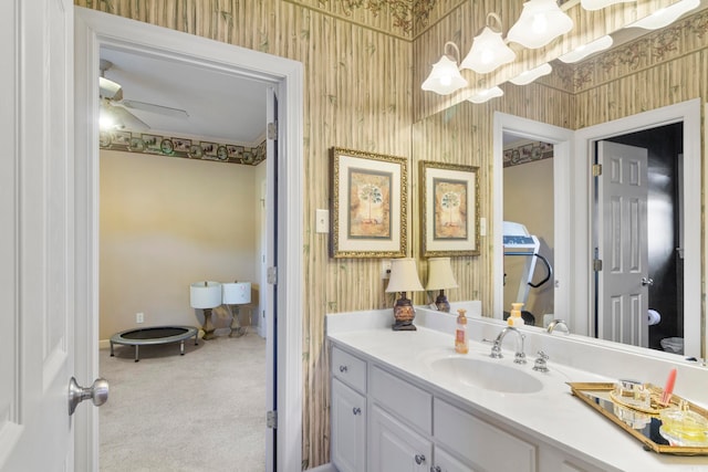 bathroom featuring ceiling fan and vanity