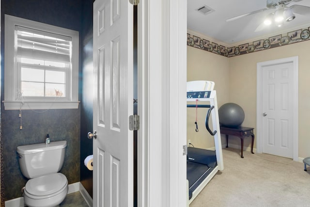 bathroom featuring toilet and ceiling fan