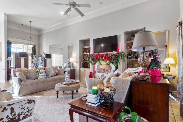 living room with ceiling fan and crown molding