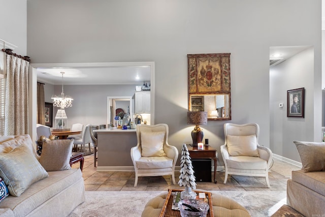 living room featuring crown molding and an inviting chandelier