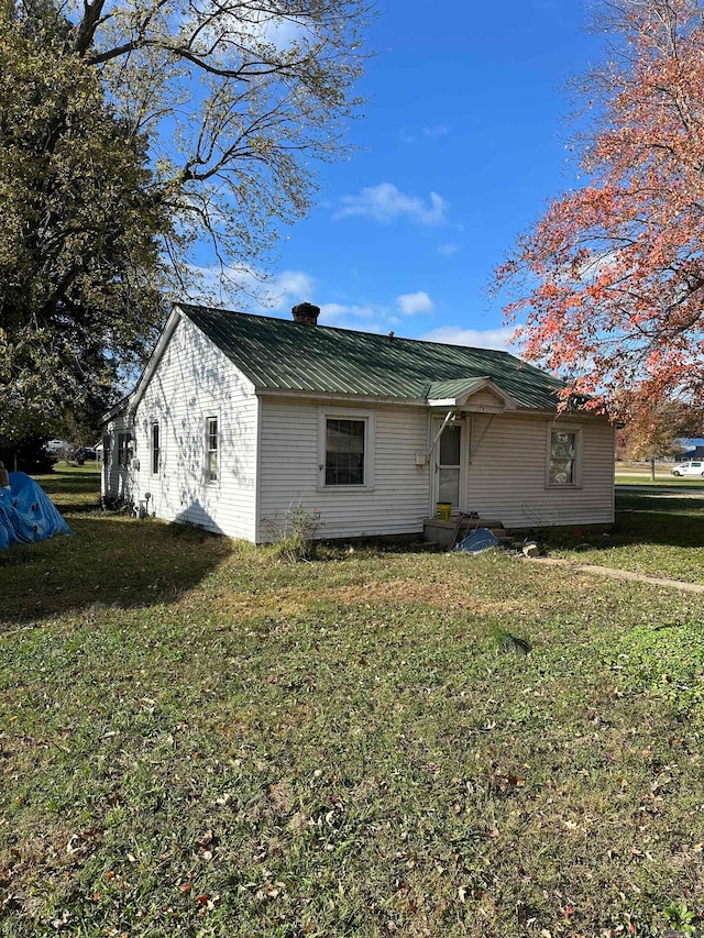 exterior space with a front lawn