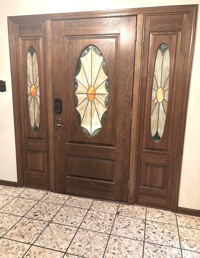 entrance foyer with light tile patterned floors