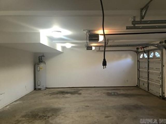 garage featuring electric water heater