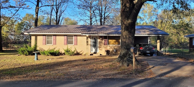 single story home with a carport