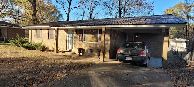 single story home featuring a carport