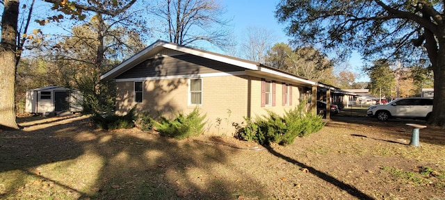 view of side of property featuring a shed