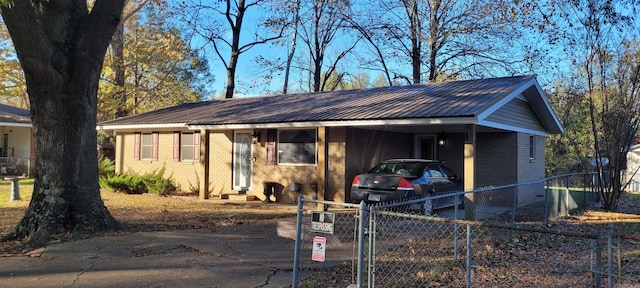 ranch-style home featuring a carport