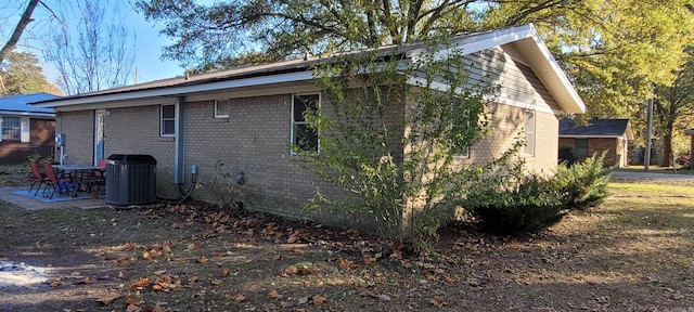 view of property exterior featuring central AC