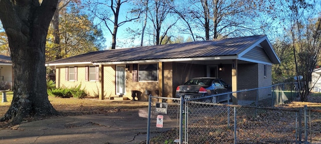 single story home featuring a carport