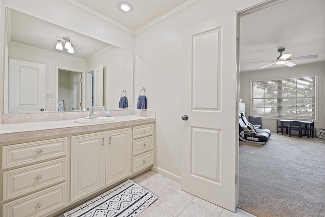 bathroom featuring ceiling fan, tile patterned flooring, vanity, and ornamental molding