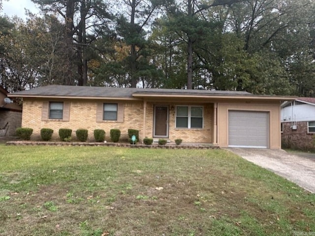 ranch-style home with a garage and a front lawn