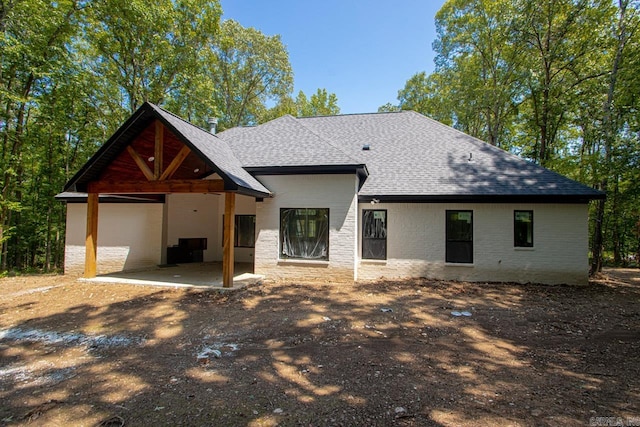 rear view of house with a patio