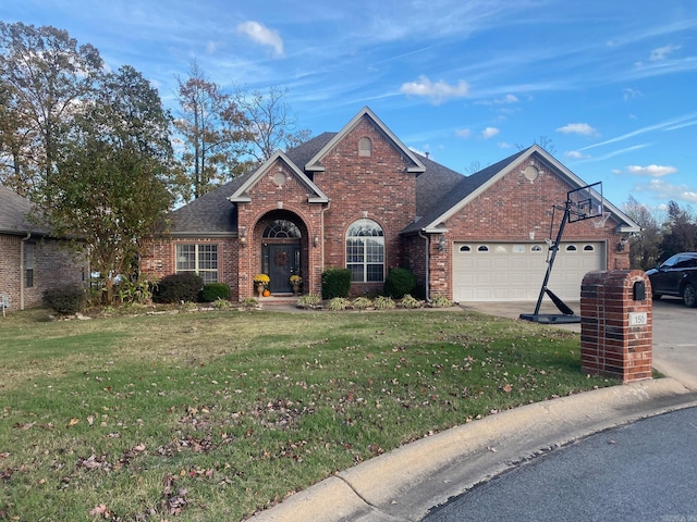 view of front property with a garage and a front lawn