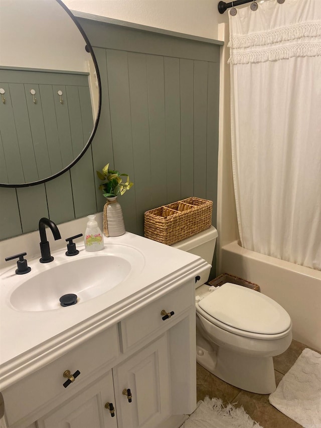 full bathroom with tile patterned flooring, shower / bath combination with curtain, toilet, and vanity