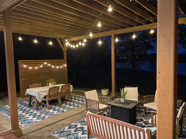 patio at twilight featuring an outdoor living space